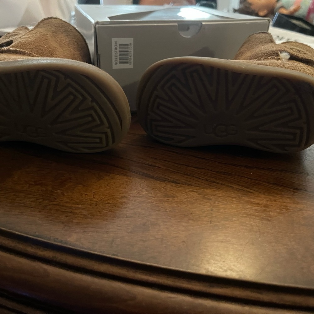 Ugg boots gently used with a stain. - Picture 2 of 7